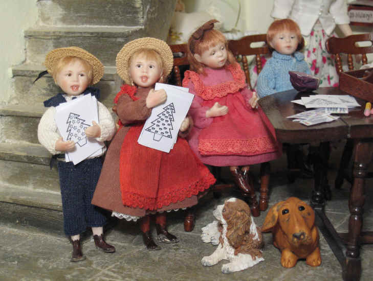 Tom and Adele are holding some of the templates as Miss Esther has given the job of handing them out to the other children.