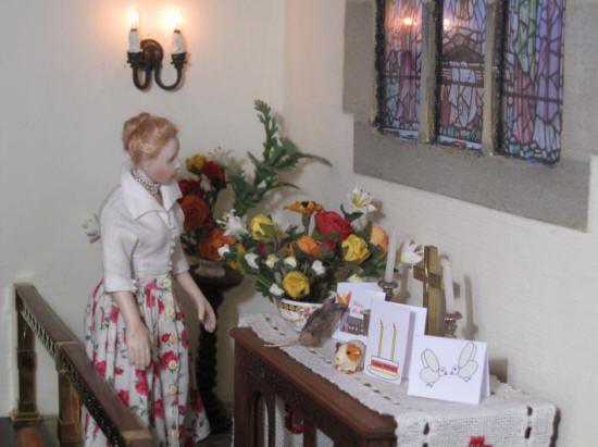 Esther checks the flowers she has arranged for Pentecost Sunday morning service.