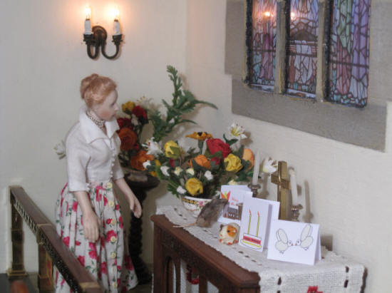 Esther checks the flowers she has arranged for Pentecost Sunday morning service.