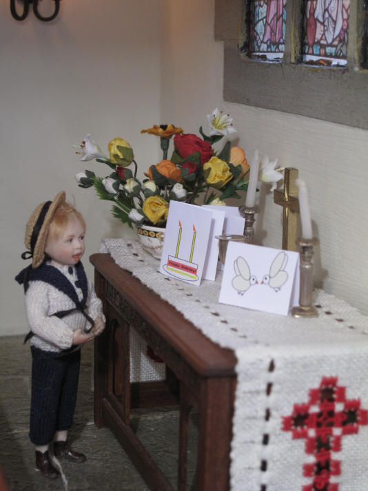 Tom's card has a birthday cake on it!  He is VERY proud of it as it now sits on the altar with the other two cards.